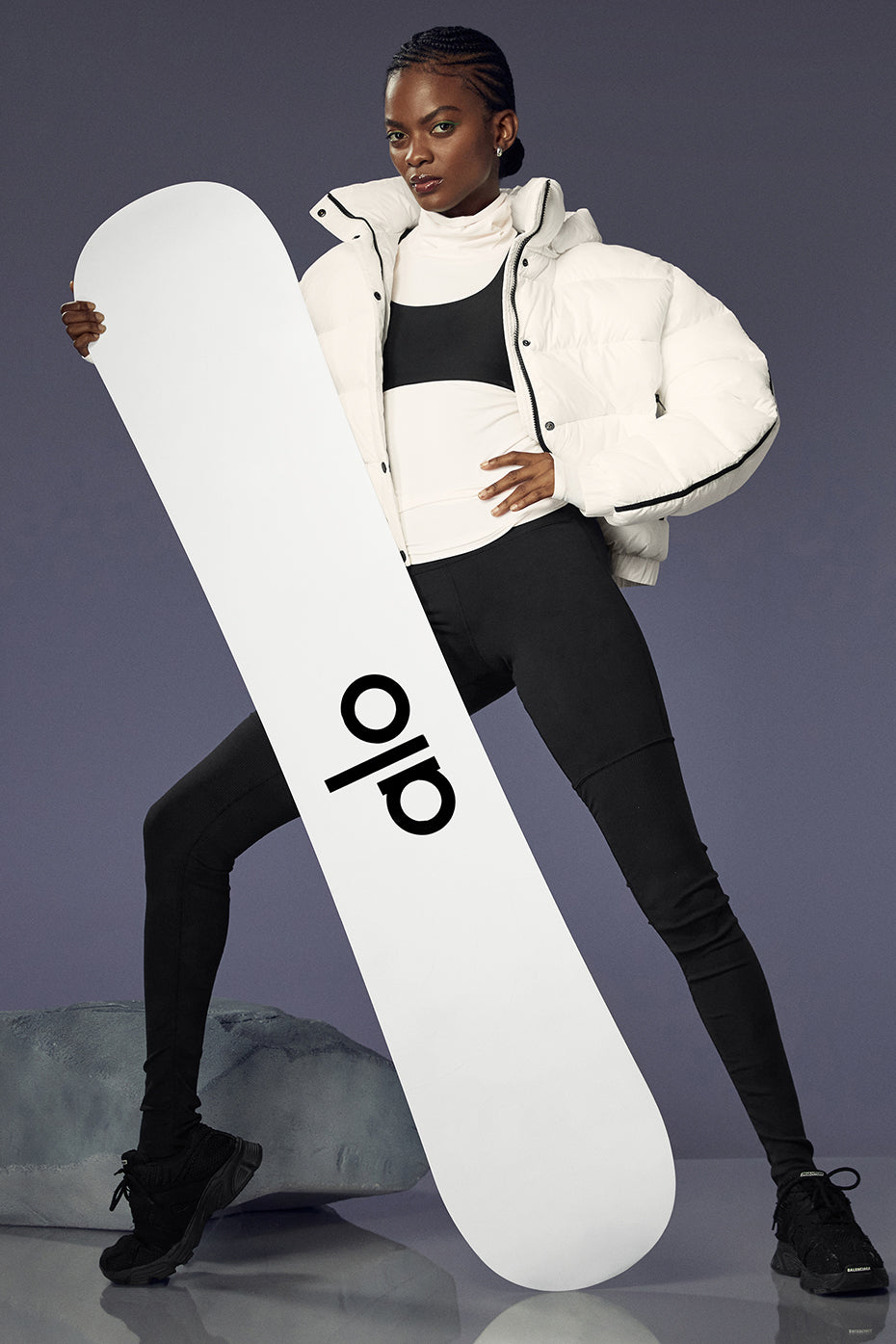 ALO Glacier snowboard showcasing its true-twin freestyle design on a snowy slope.