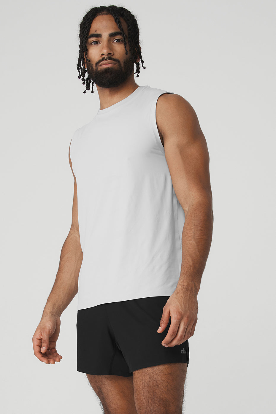 Model wearing Titanium Elite Performance Tank while jogging outdoors.