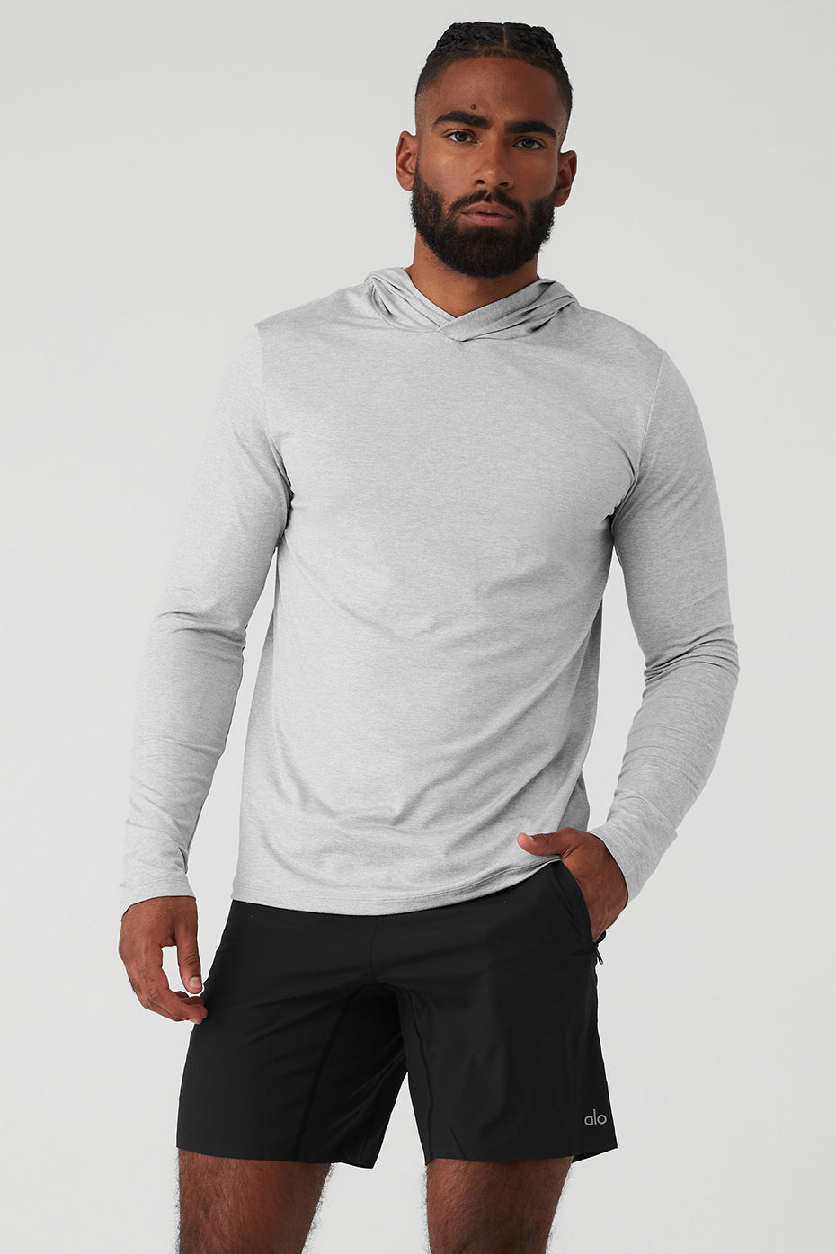 Close-up of the Conquer Reform Long Sleeve Athletic Hoodie fabric highlighting moisture-wicking technology