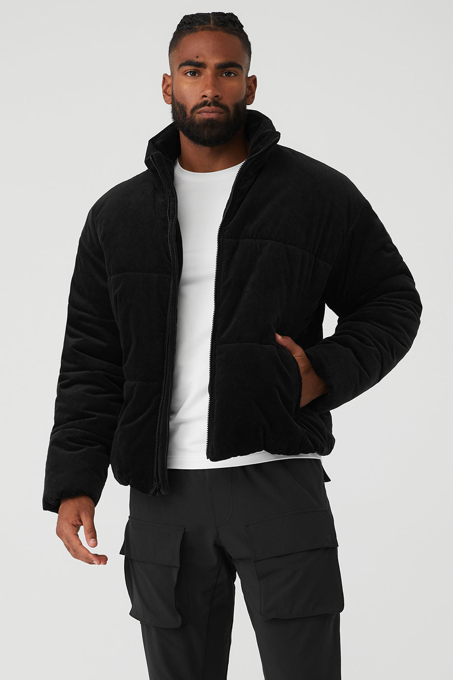 Front view of cozy black winter jacket with zippered side pockets.