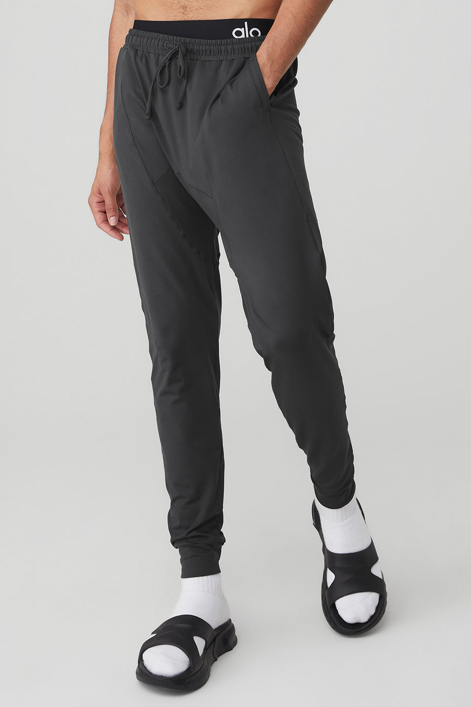 Model wearing anthracite wide leg yoga pants during yoga session, showcasing comfort and style