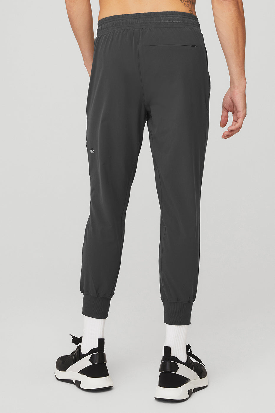 Side view showcasing drawcords and zip pockets on cargo pants.