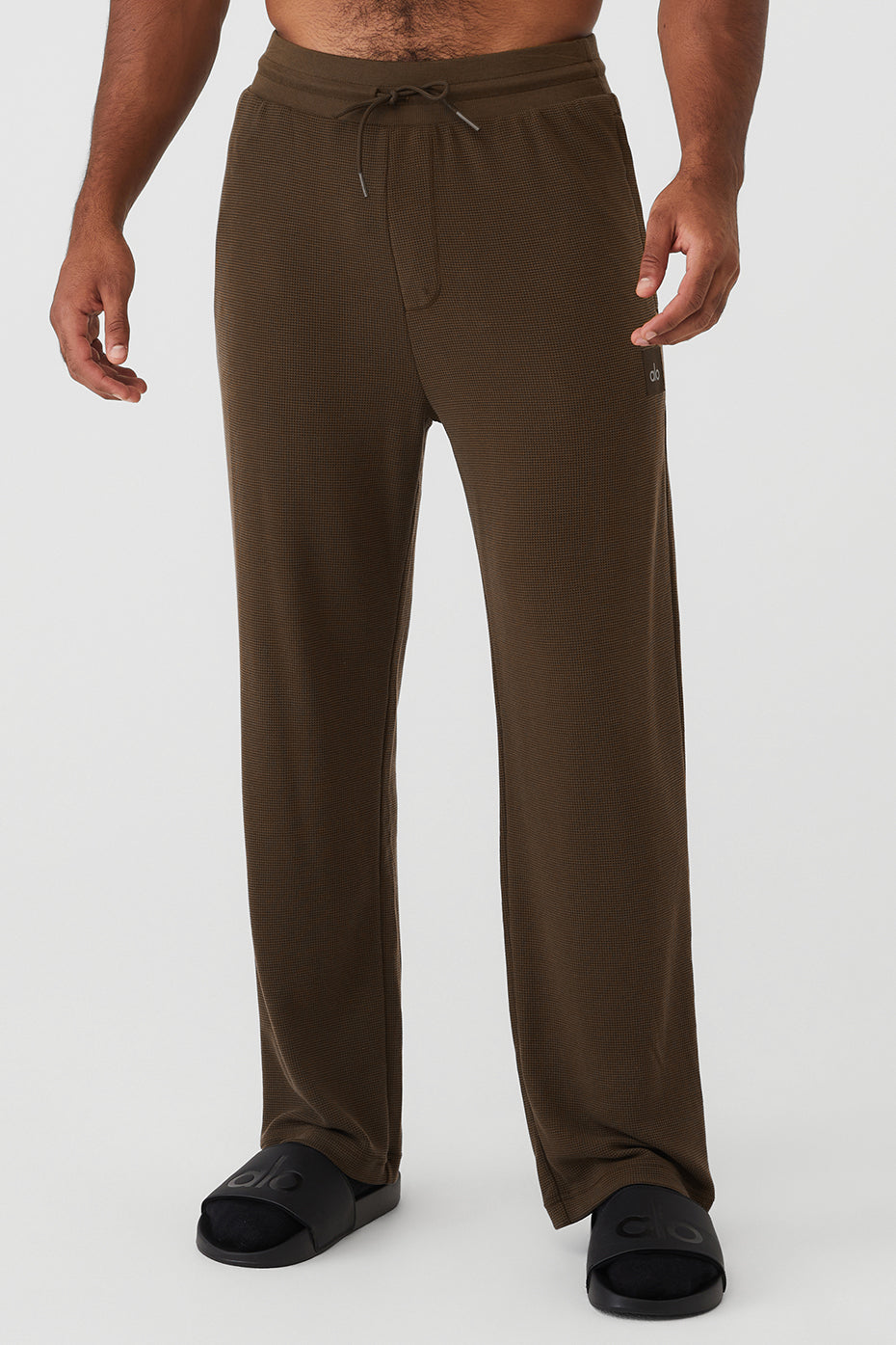 Espresso thermal joggers displayed on a model in a casual setting.