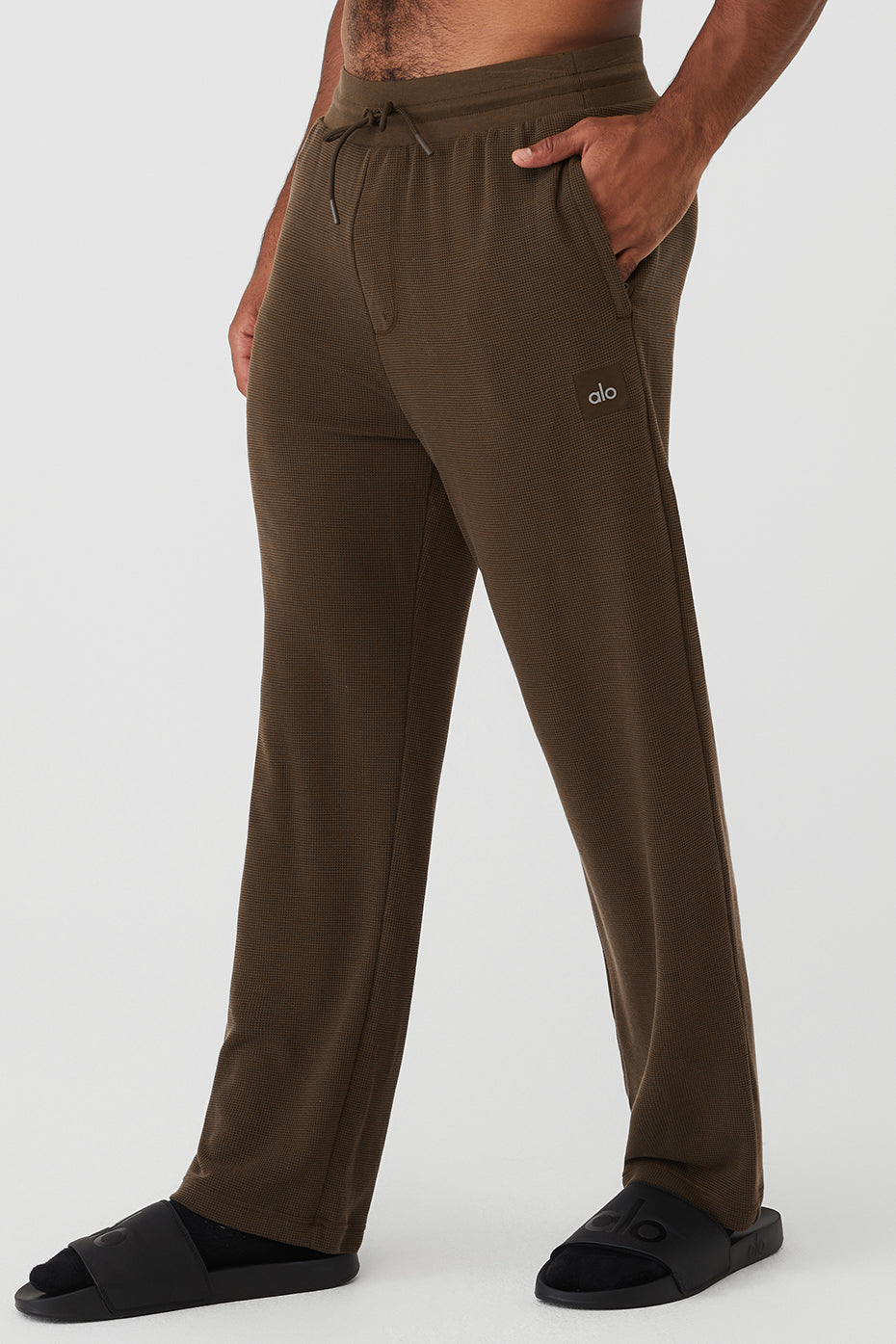 Model wearing espresso joggers paired with a matching top for a stylish look.