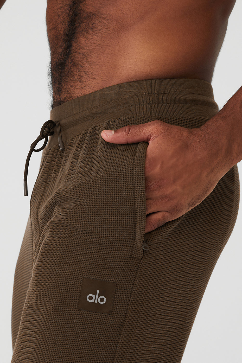 Espresso thermal joggers displayed on a model in a casual setting.
