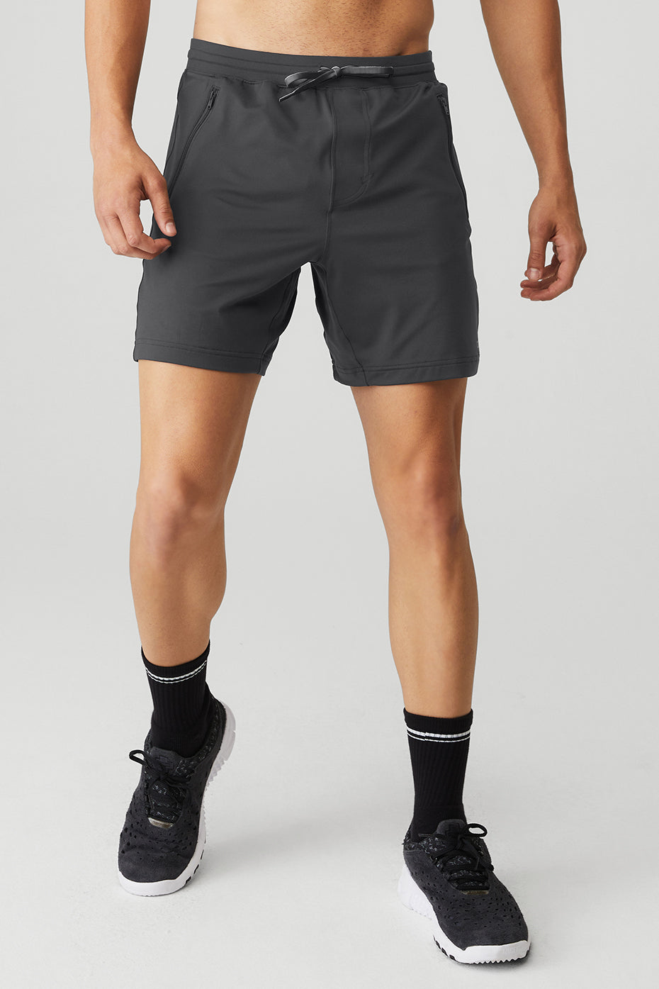Aerial view of anthracite comfortable shorts folded on a wooden bench