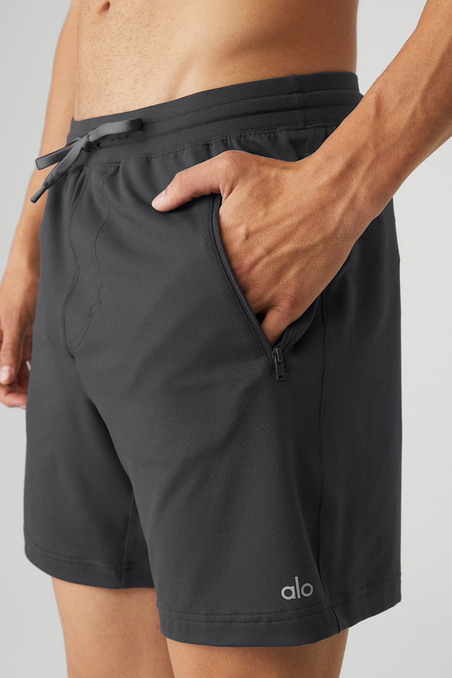 Aerial view of anthracite comfortable shorts folded on a wooden bench