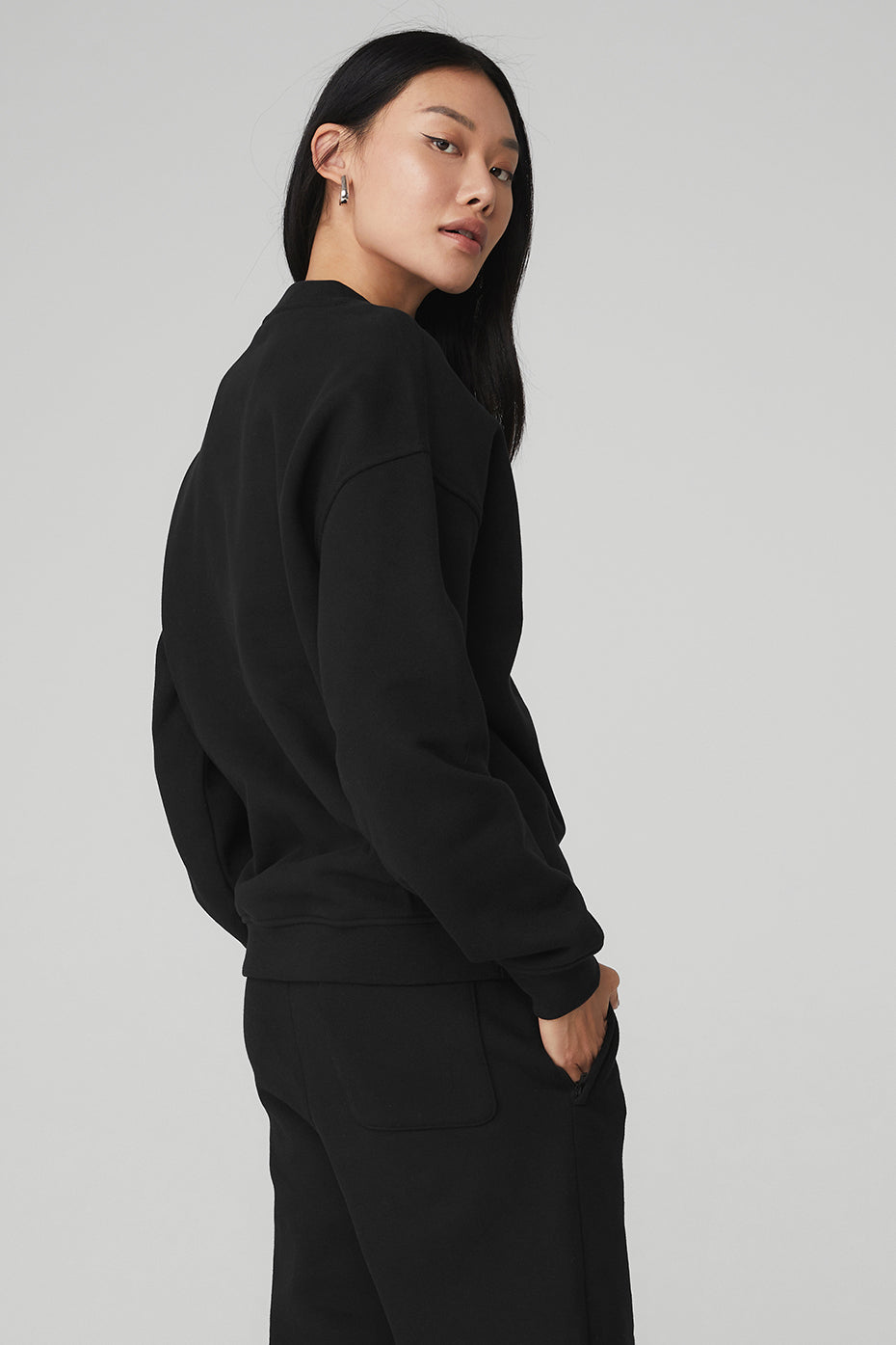 Close-up of ribbed cuffs and crew neck on sweatshirt