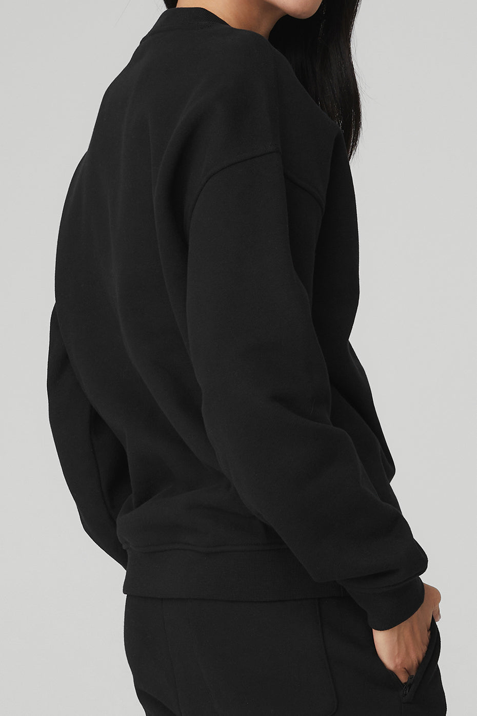 Close-up of ribbed cuffs and crew neck on sweatshirt