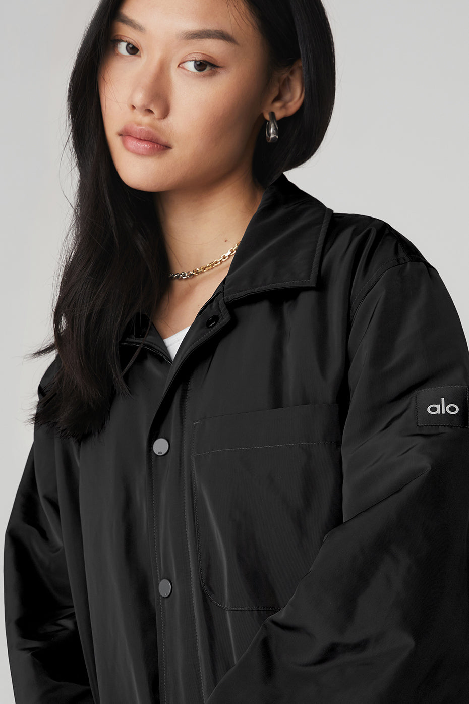 Side view of the Urban Legend Lightweight Jacket highlighting its sleek nylon lining and cinched cuffs.