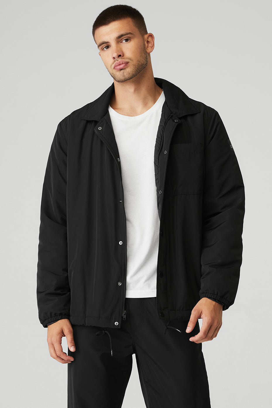 Front view of unisex lightweight puffer jacket styled for fall in Charlotte