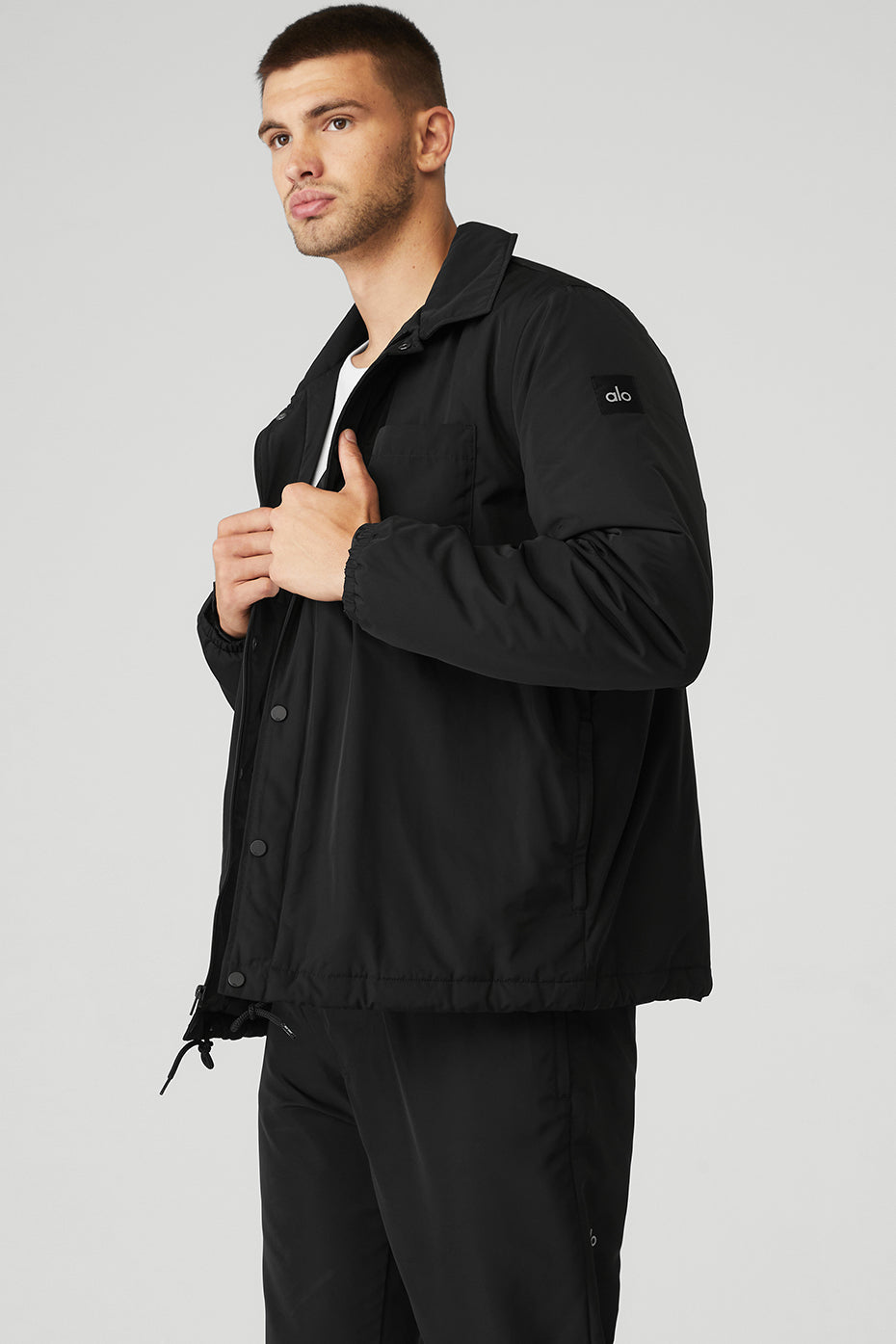 Back locker loop and shoelace hem detail on mens lightweight jacket
