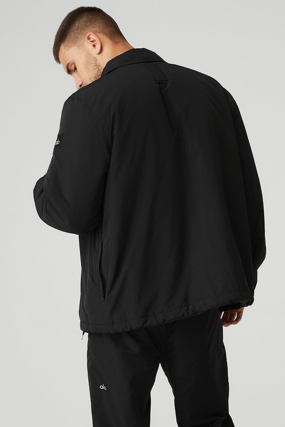 Close-up of collar and cinched cuffs on lightweight denim jacket alternative