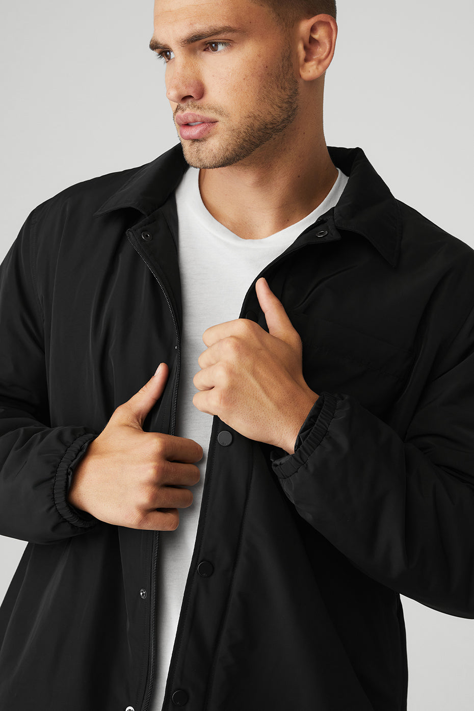 Front view of unisex lightweight puffer jacket styled for fall in Charlotte