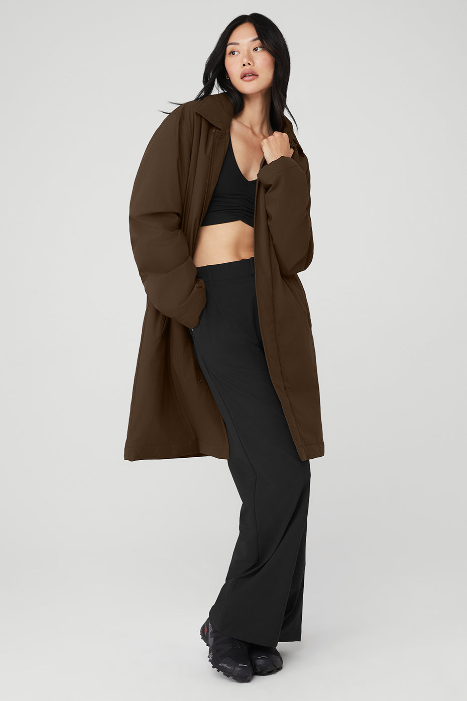 Front view of espresso streetwear coat styled for unisex fit