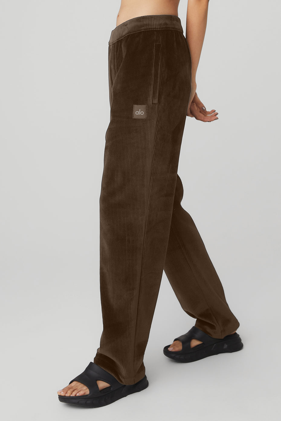 Model wearing espresso velour baller pants with a matching hoodie.