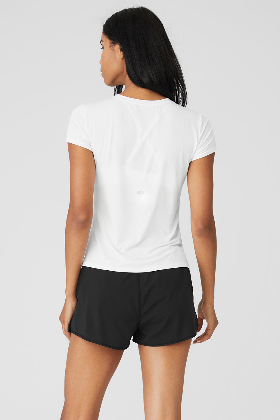 Super soft t shirts for printing displayed folded on wooden counter with tags showing modal material