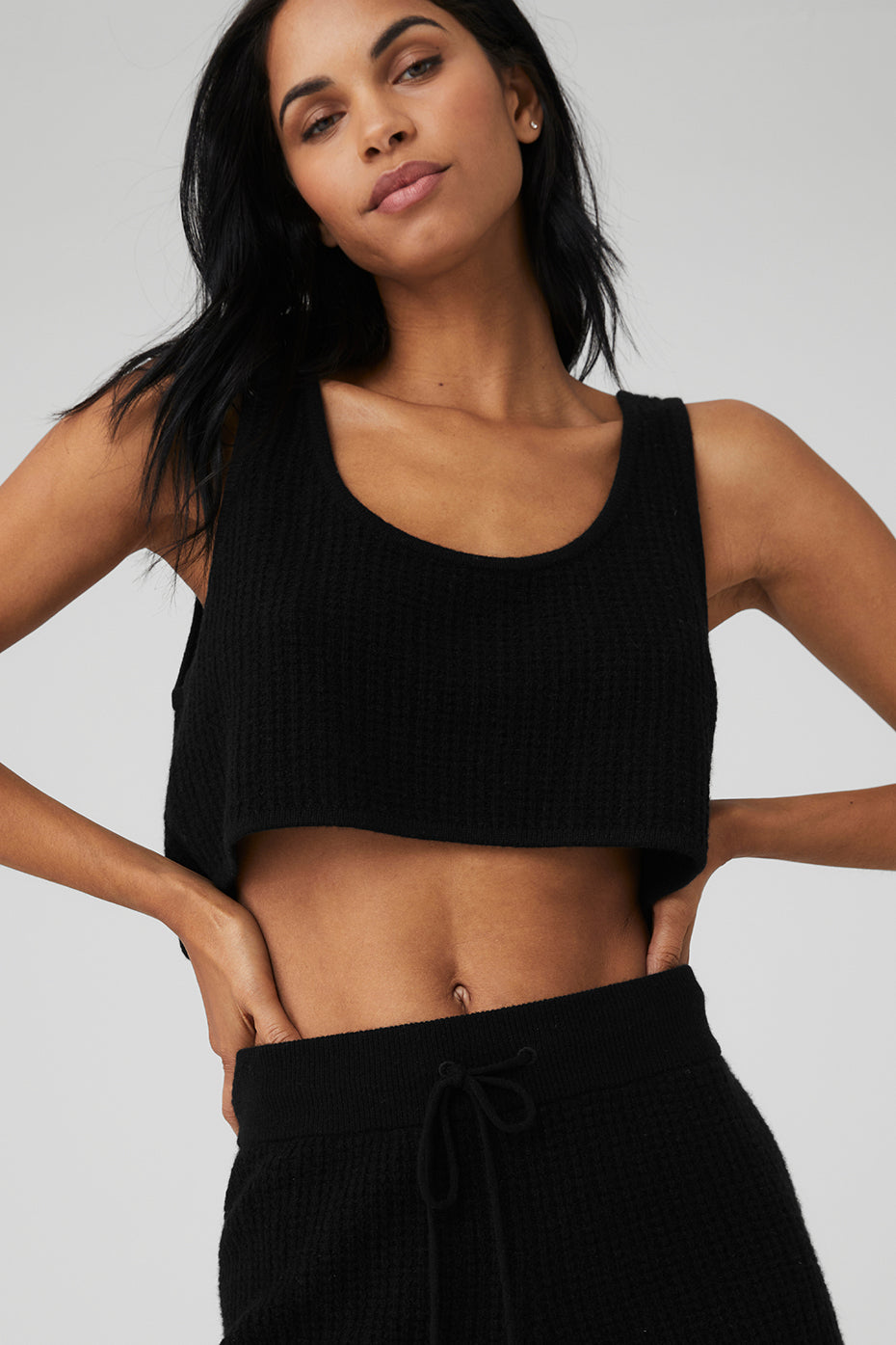 Side view of the cashmere waffle tank, highlighting its loose fit and lightweight fabric.