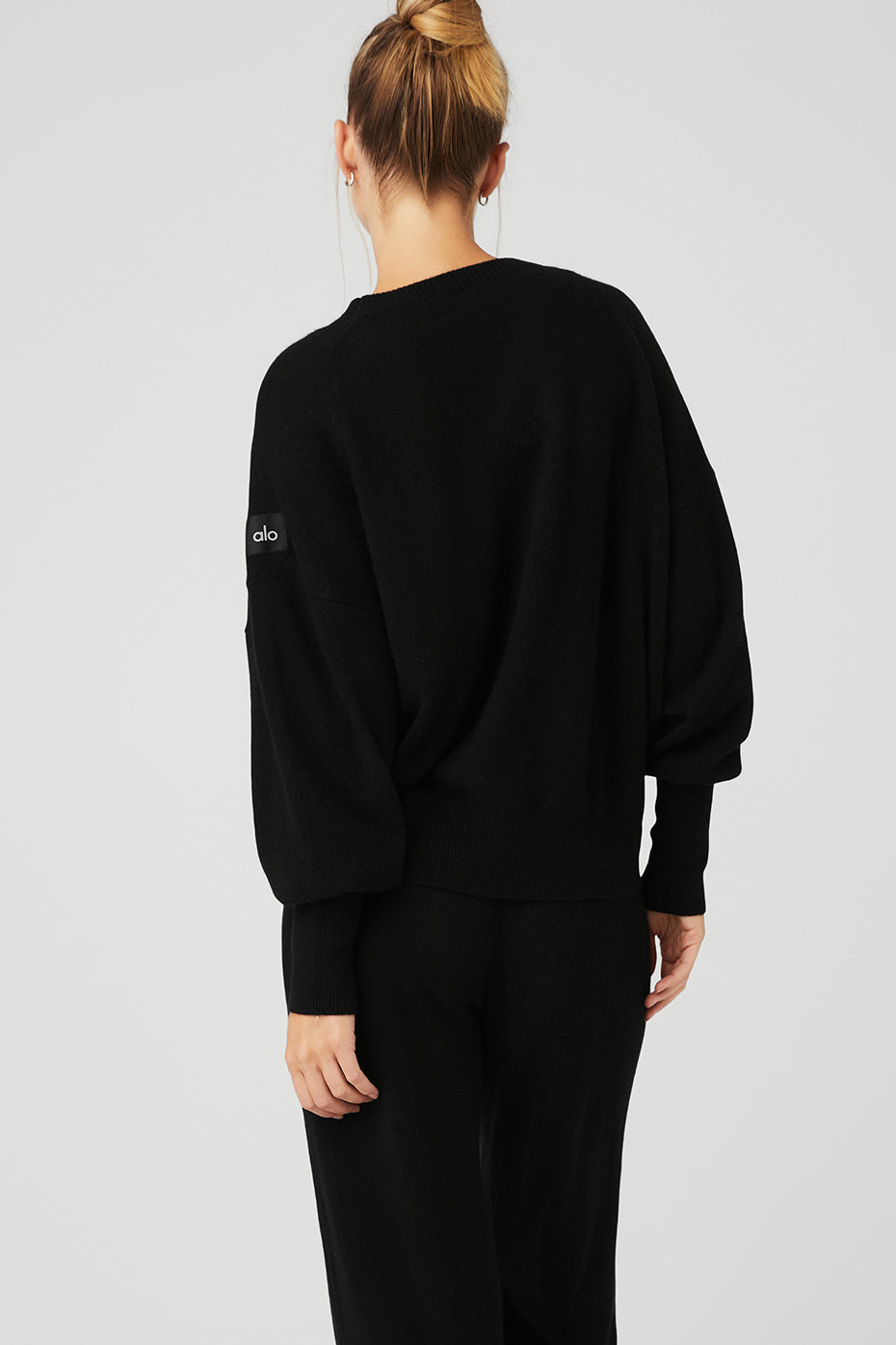 Close-up of ribbed cuffs and shoulder panel detailing on cashmere sweater