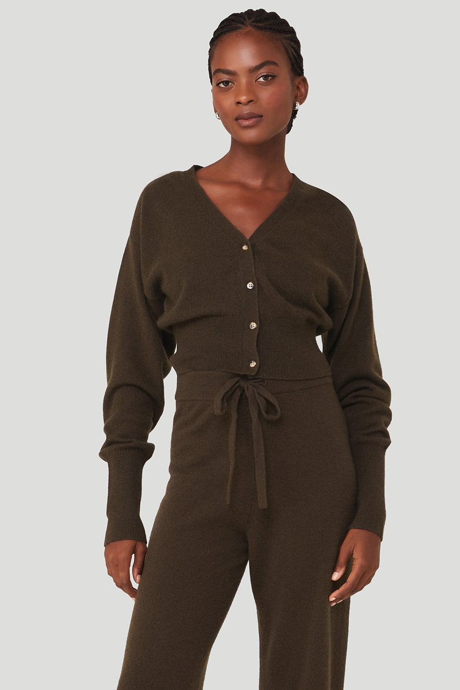 Front view of a black cashmere cardigan sweater with ribbed cuffs and hem