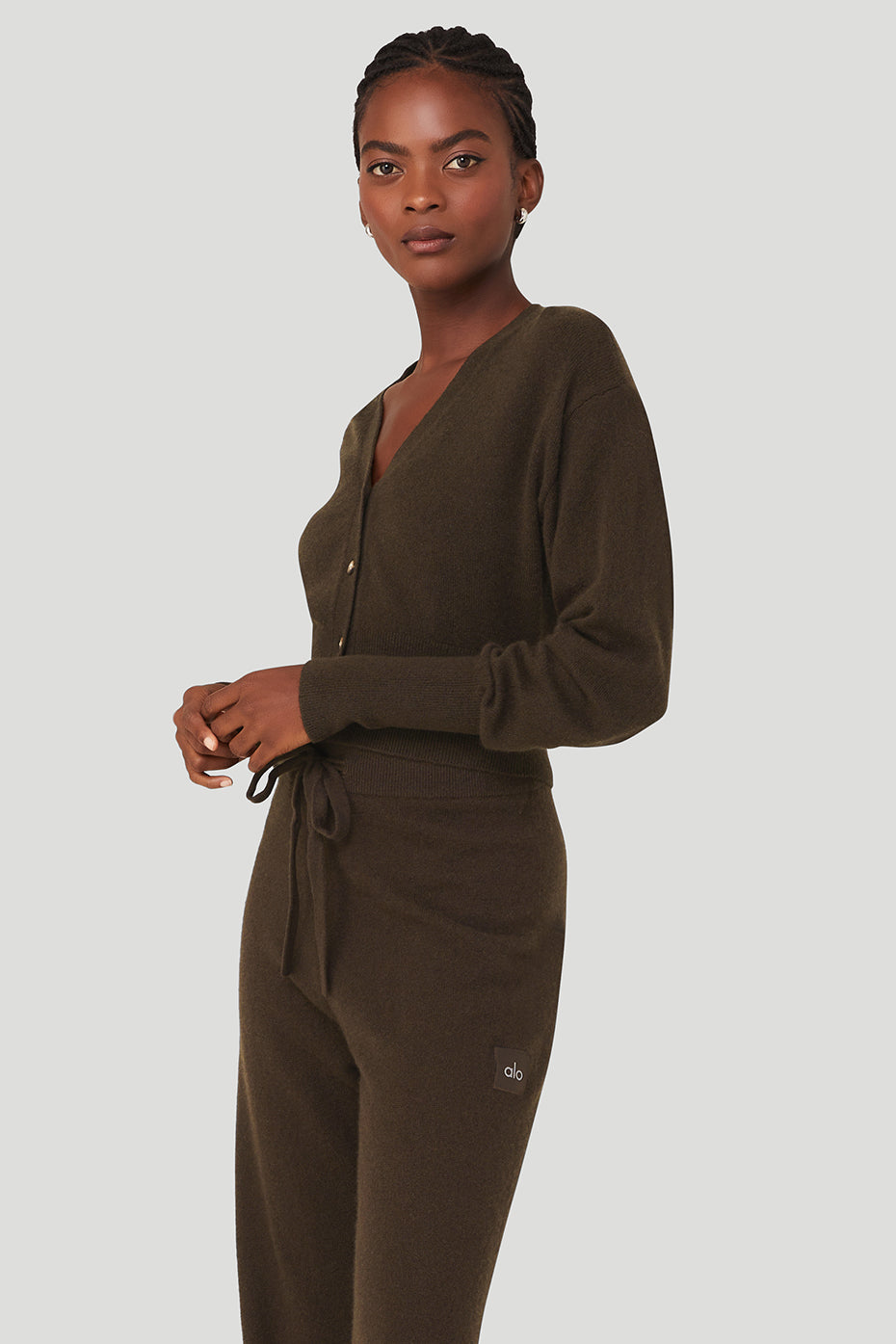 Close-up of a deep V-neckline on a cashmere cardigan, showcasing quality knit details
