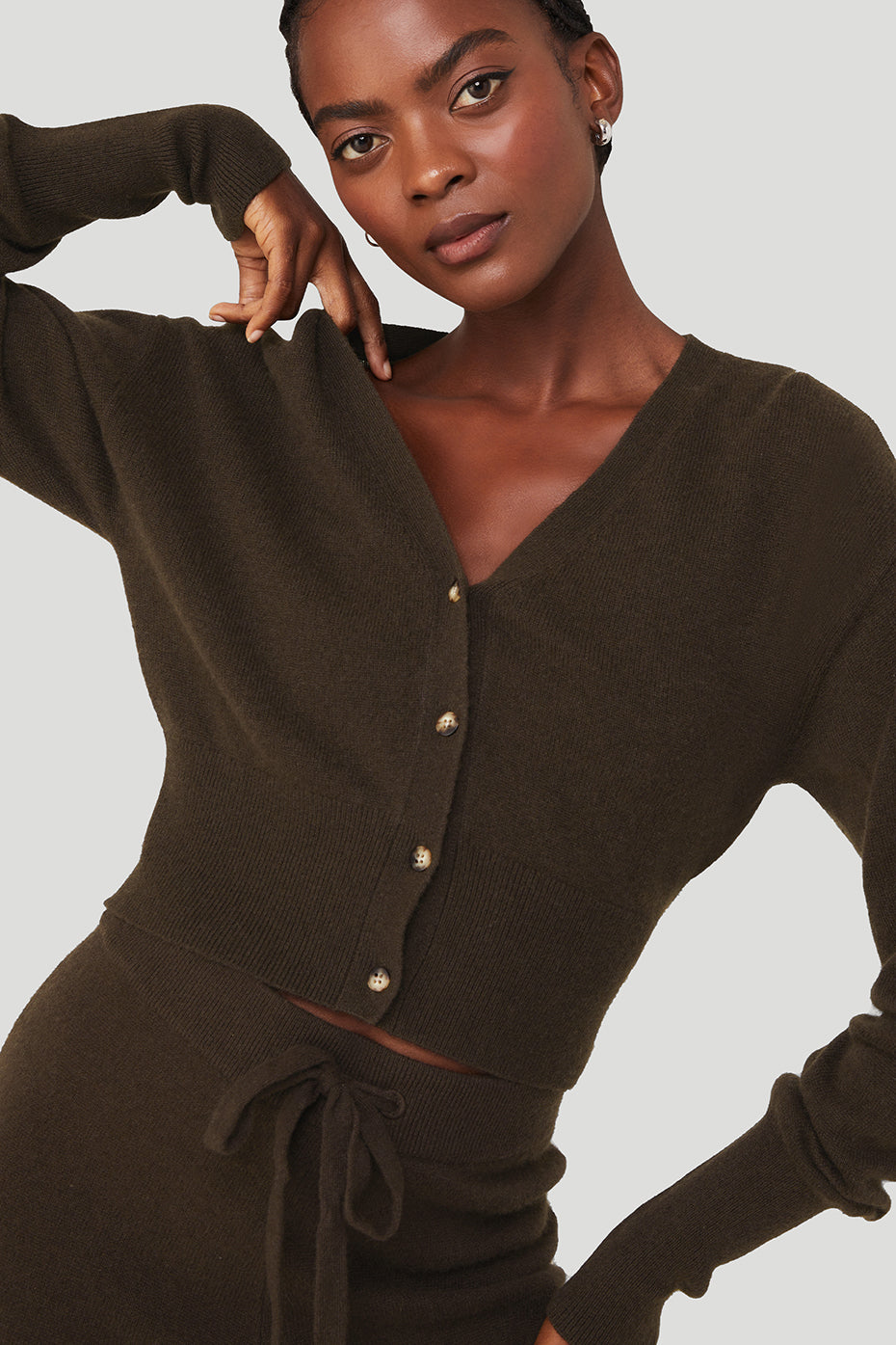 Front view of a black cashmere cardigan sweater with ribbed cuffs and hem
