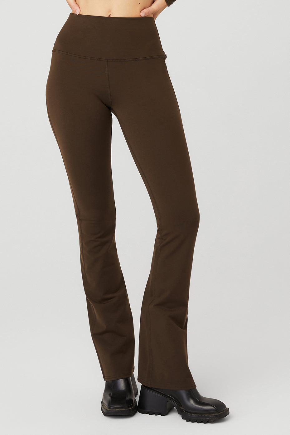 Front view of sculpting high-waist bootcut leggings in espresso.