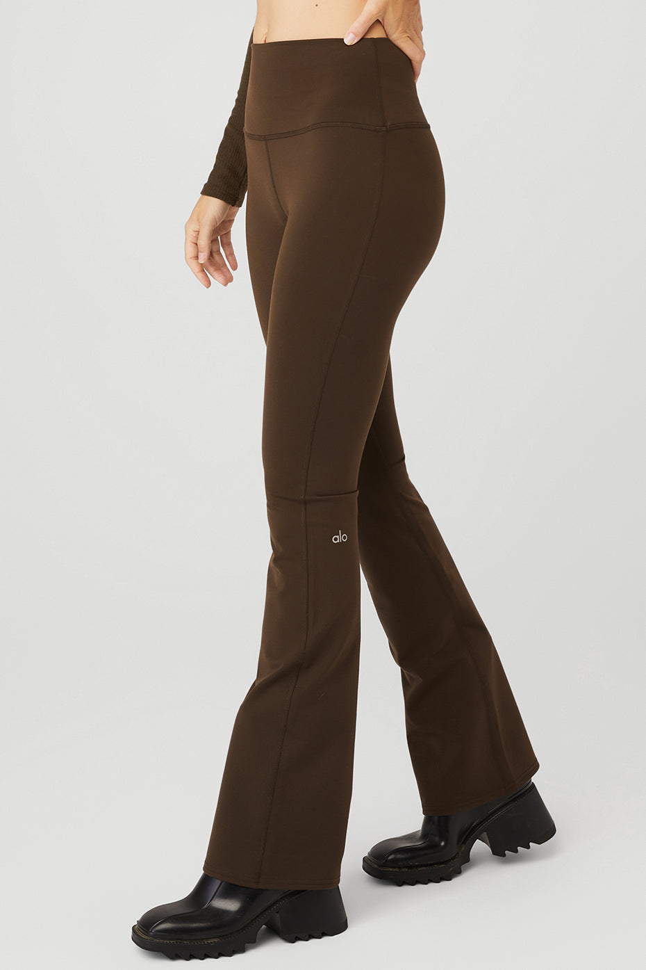 Back view highlighting the wide waistband of high-waist leggings.