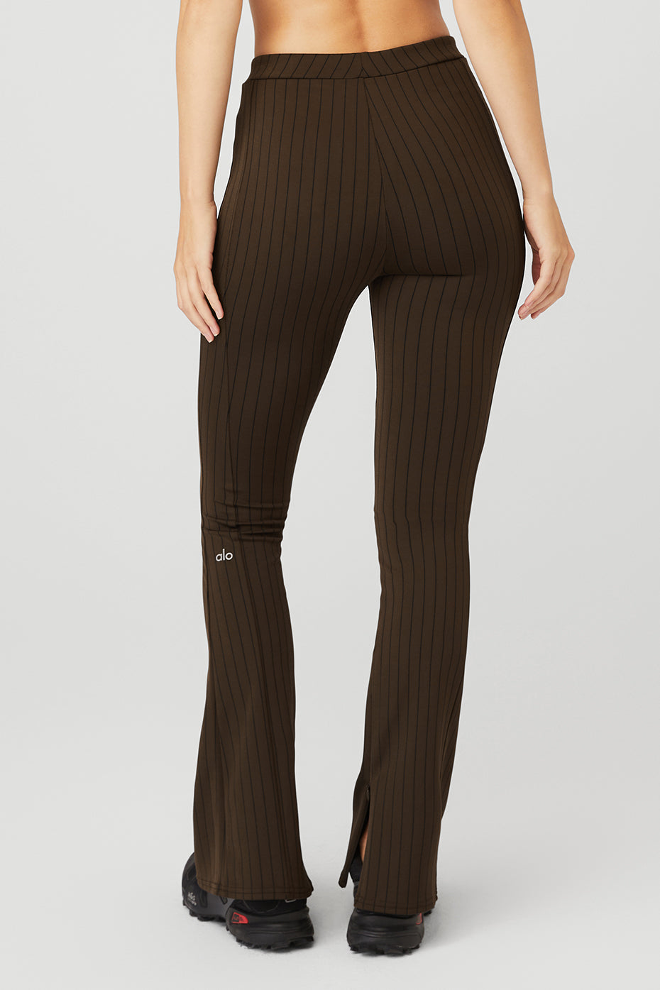 Close-up of the hidden zipper detail on the inside leg of the flare leggings