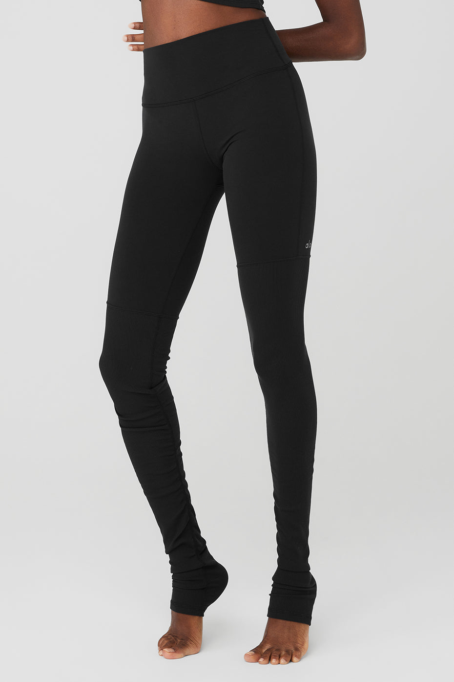 Ribbed bottoms of the leggings styled scrunched for casual look