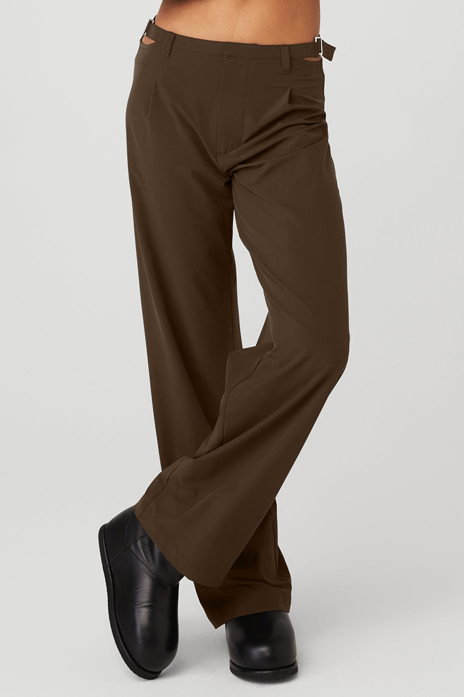 Front view of espresso trousers showing hip cut outs and buckle detail
