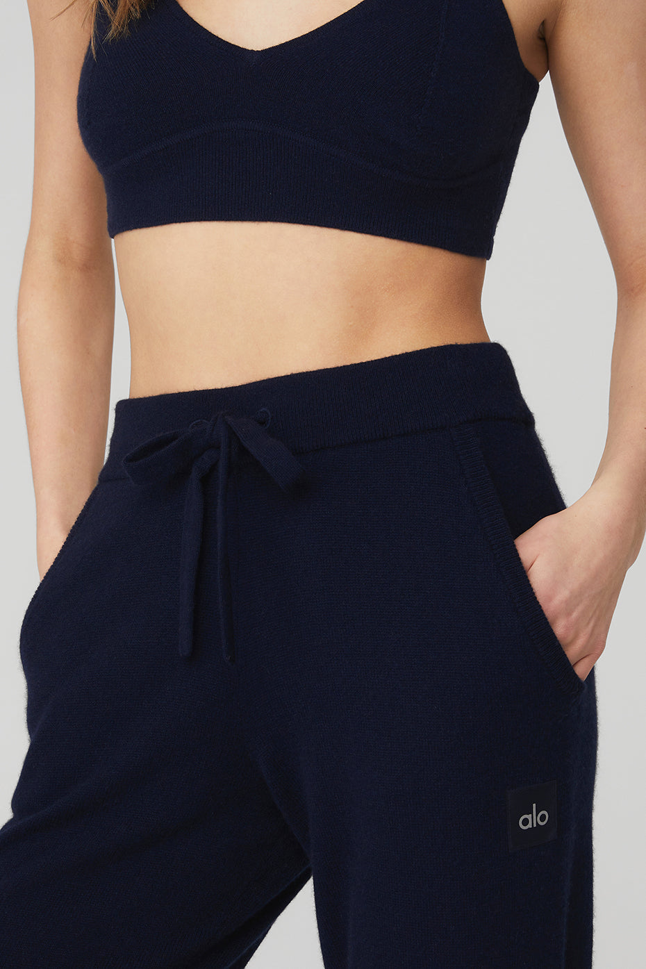 Close-up of high-waist cashmere pants showcasing the luxe fabric texture