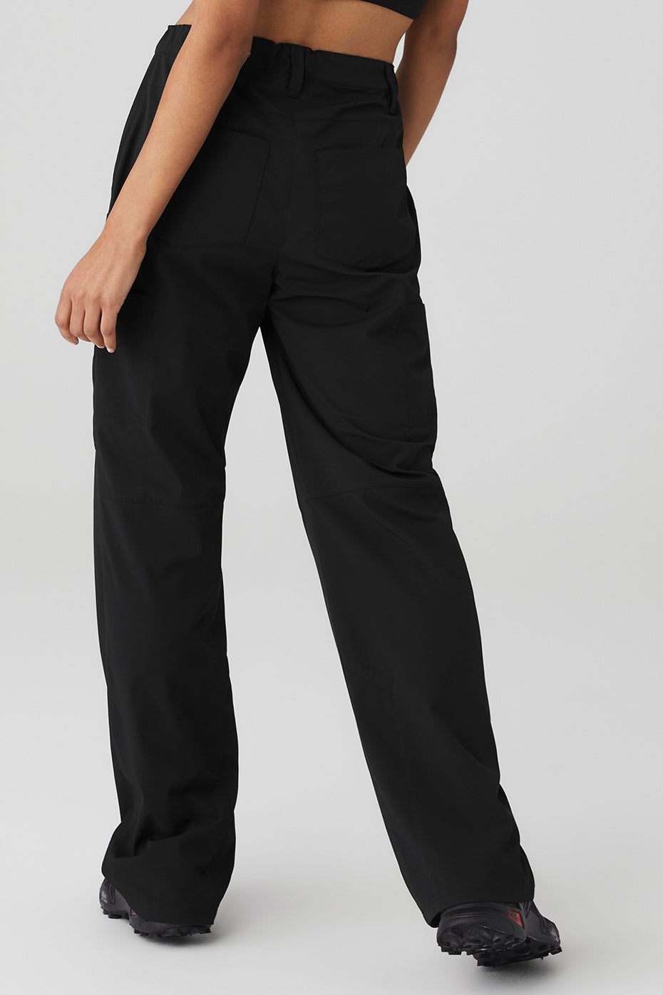 Close-up of the trousers welt pockets and sleek finish