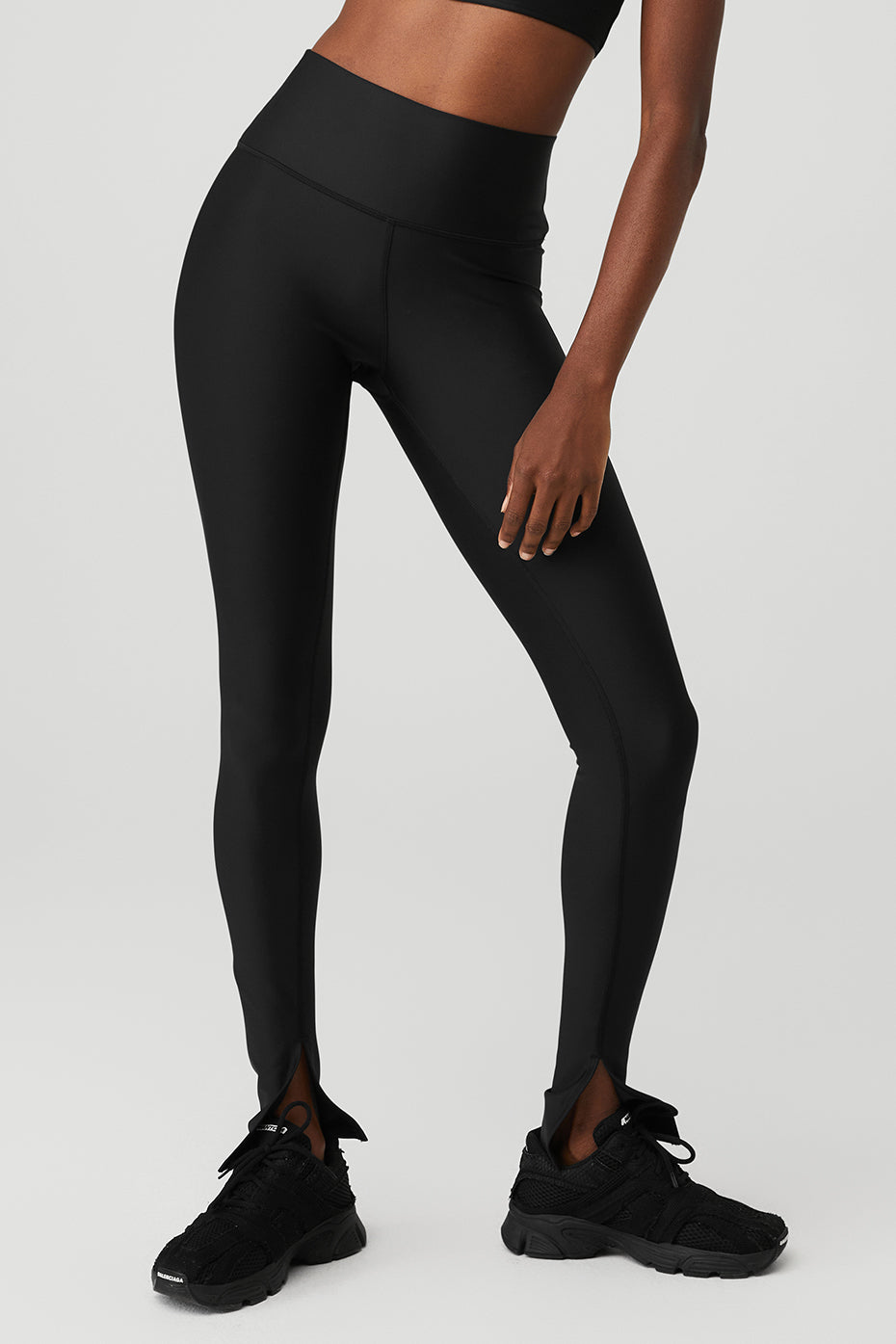 Front angle of black elongated leggings showcasing high waist fit