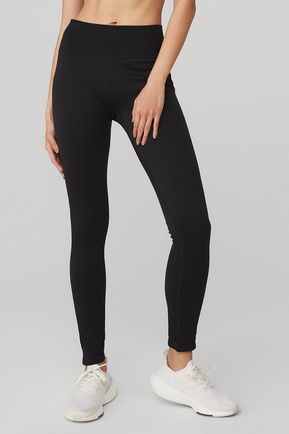 Front view of high-waist ribbed leggings in black, showcasing the fit and ribbed detail