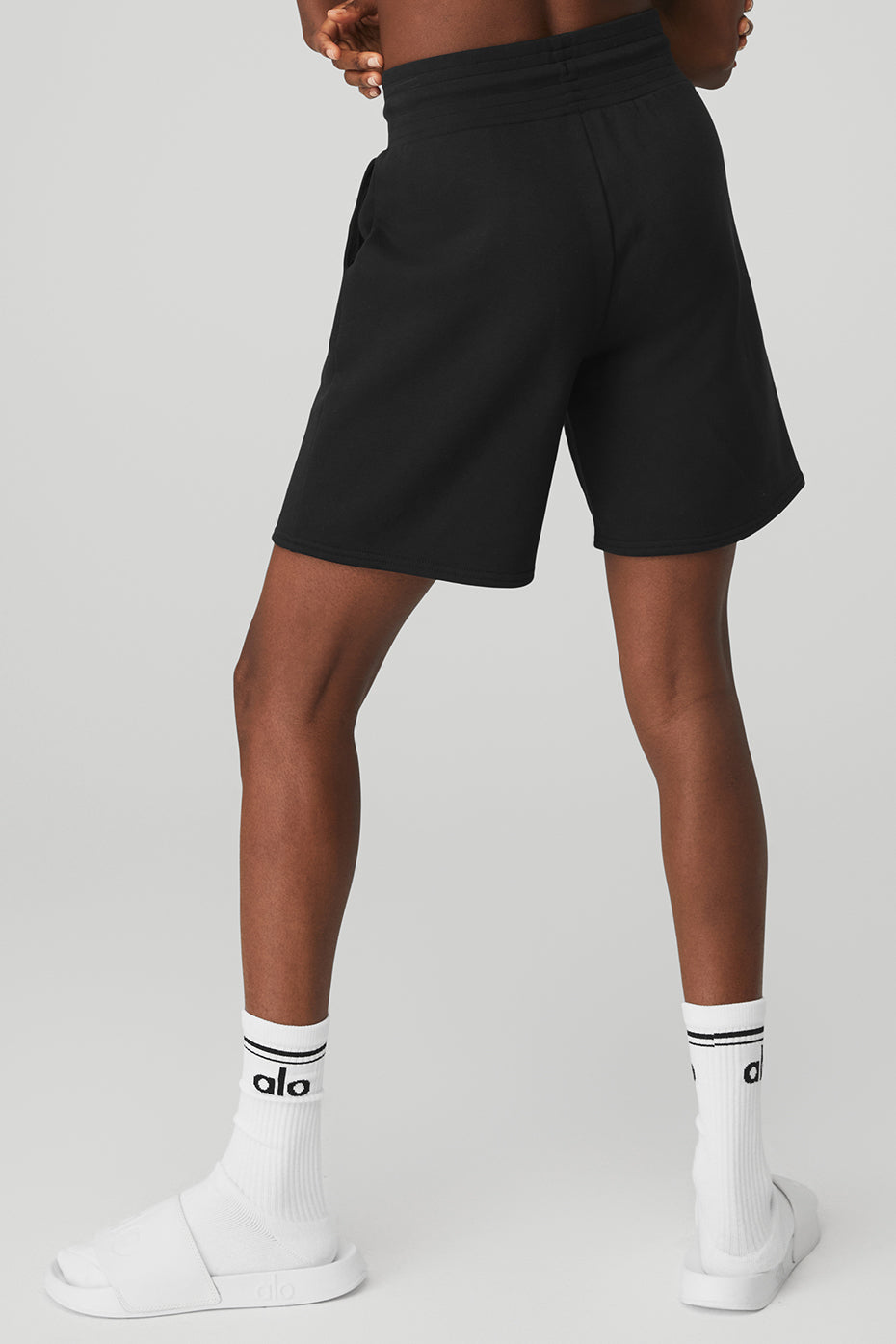 Flat lay of sweat shorts women’s cut, showing fleece texture and drawcords