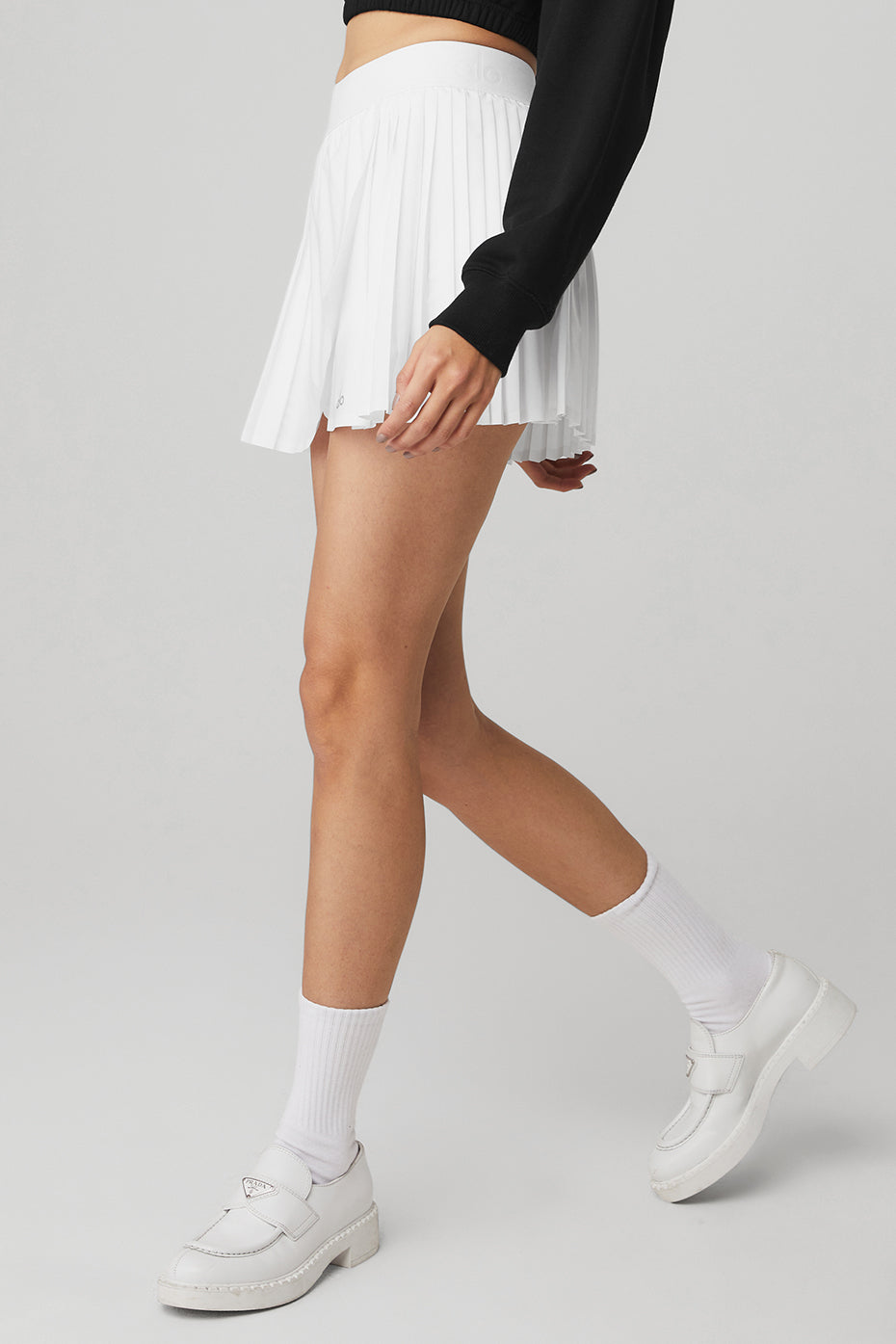 Back view of the Aces tennis skirt in white, emphasizing its stylish fit.