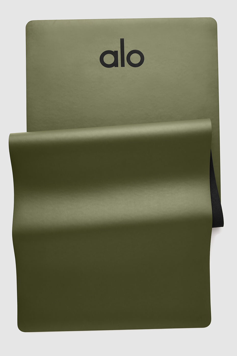 JungleGrip Warrior mat rolled out in studio with earthy tones and textured slip-free surface