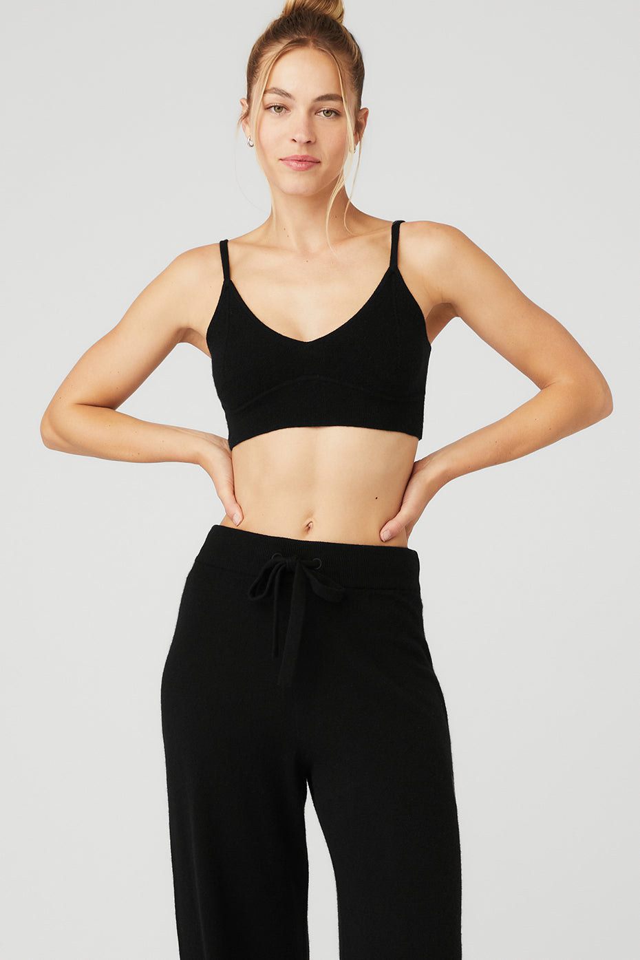 Front view of the luxurious cashmere comfort bra in black, showcasing its deep V-neck design.