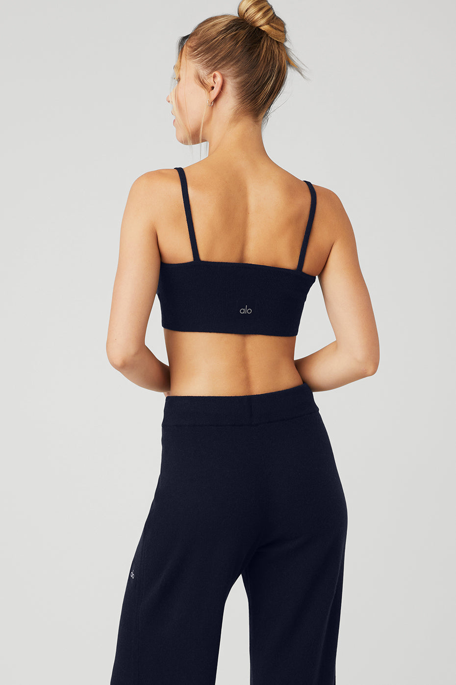 Close-up of the deep V-neck design of the Khaite luxury bralette.