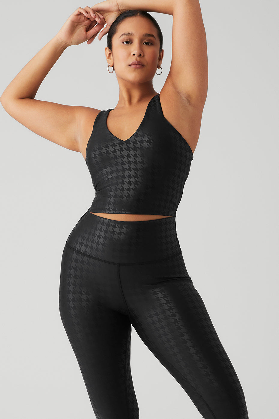 Front view of the Airlift Glimmer Bra Tank in black, showcasing the houndstooth design.