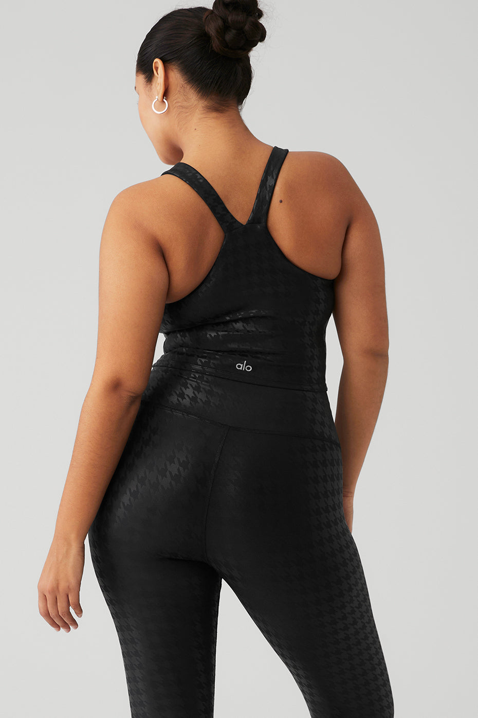 Side view of the Airlift Glimmer Bra Tank, highlighting the built-in bra feature.